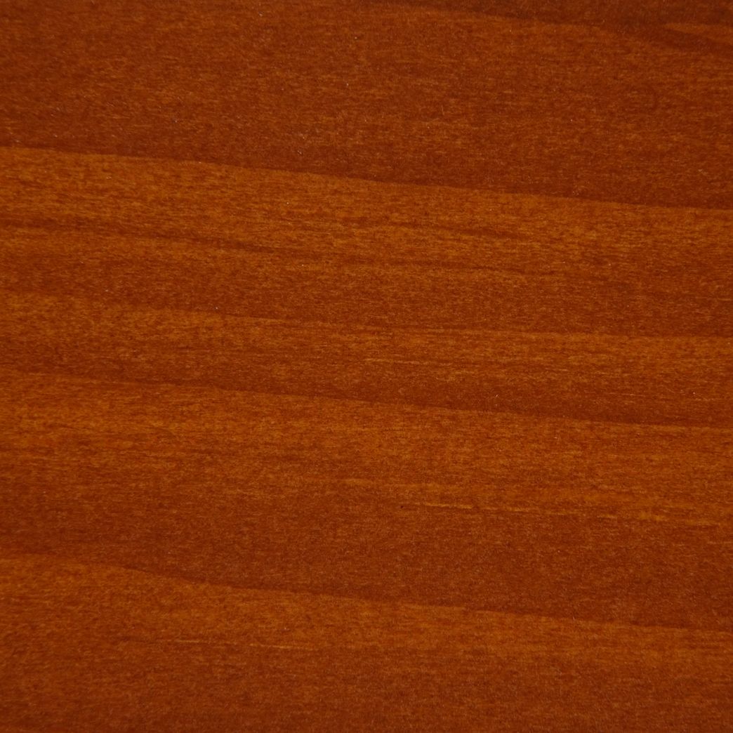 Un gros plan d'un morceau de bois montrant le grain et la texture.