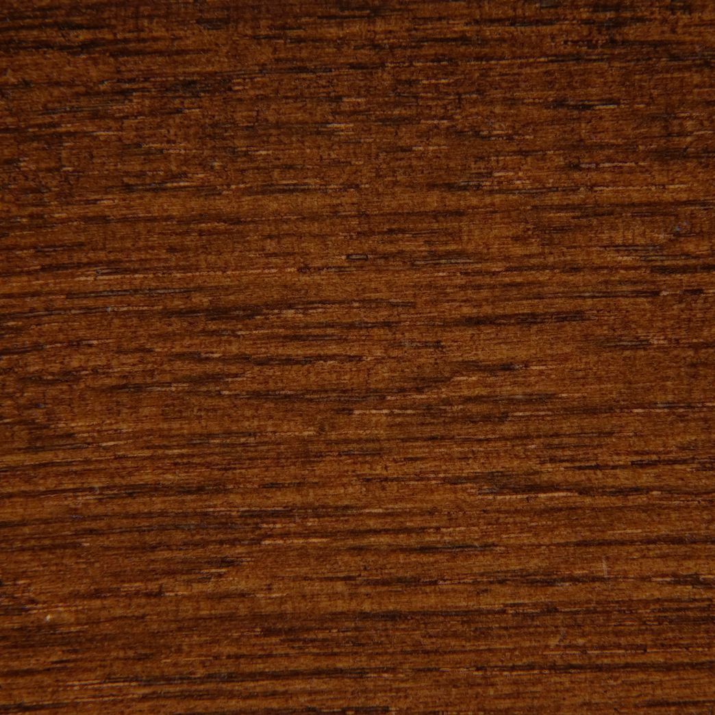 Un gros plan d'une texture de grain de bois brun.