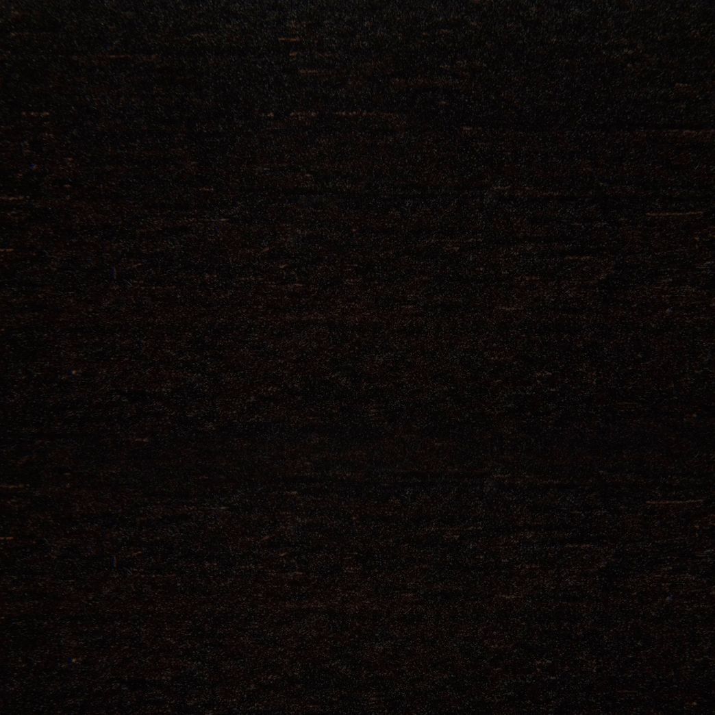 Un gros plan d'une texture de tapis noir.
