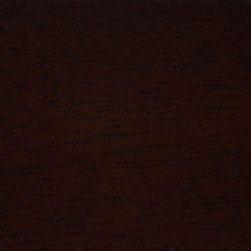 Un gros plan d'une texture de grain de bois brun foncé.