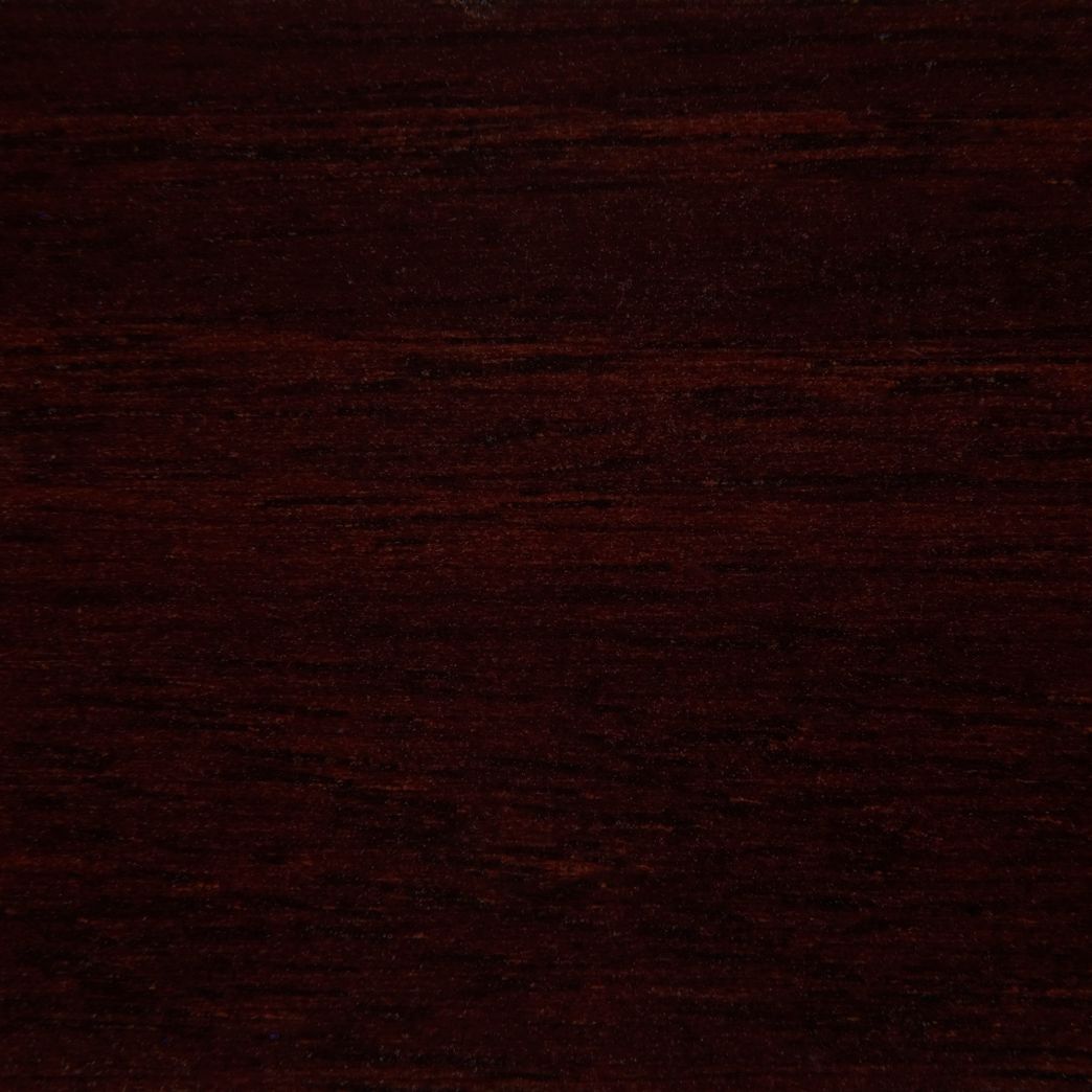 Un gros plan d'une texture de grain de bois brun foncé.