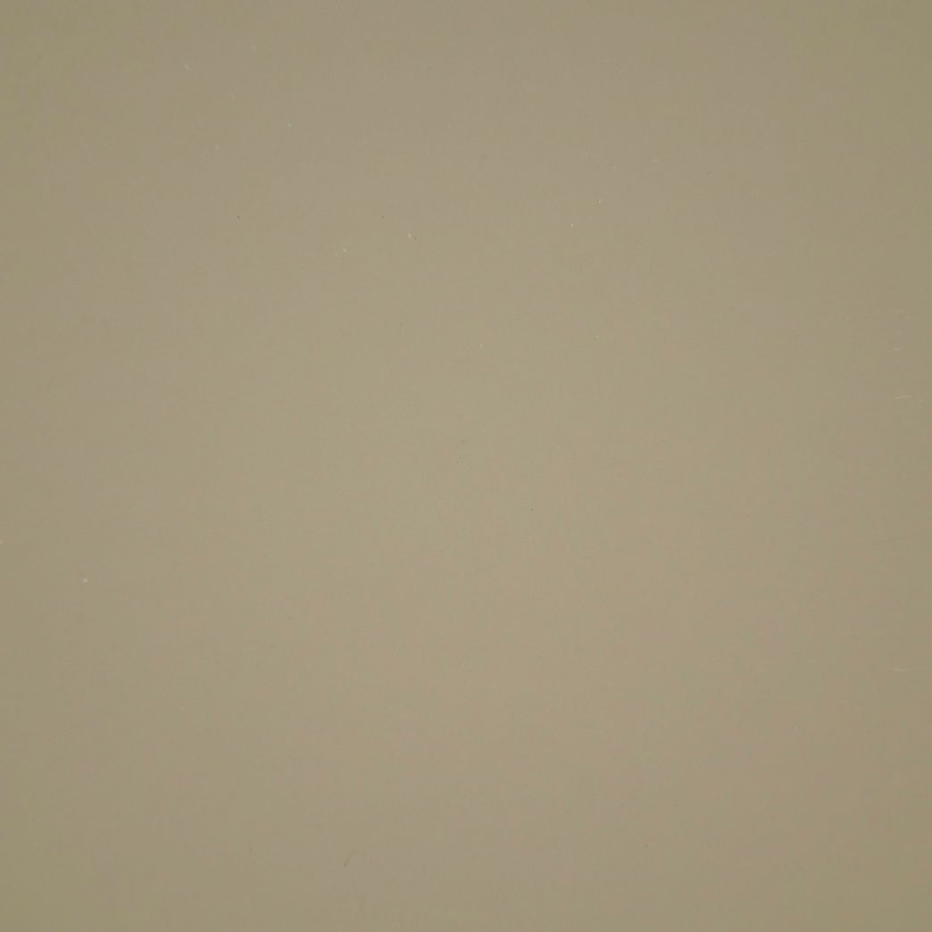 Un gros plan d'une texture de papier beige.