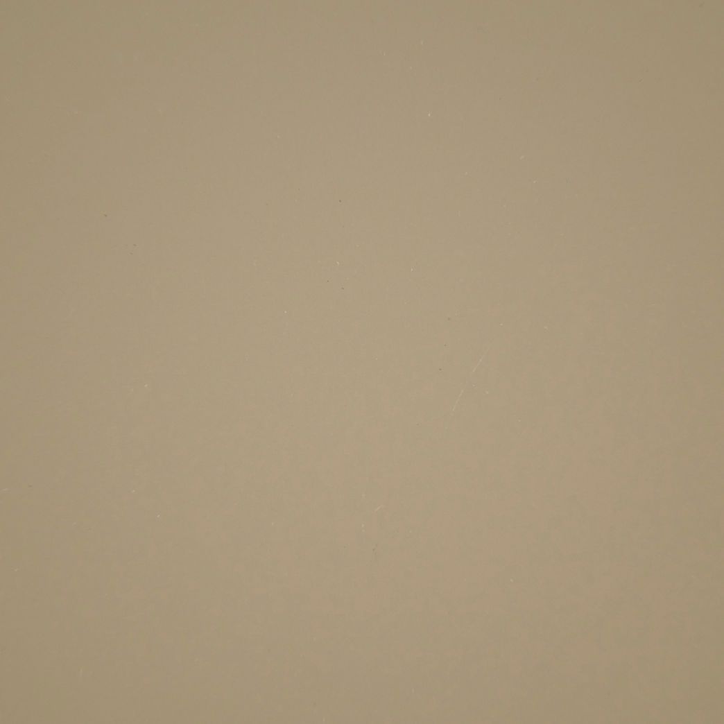 Un gros plan d'une texture de papier beige.