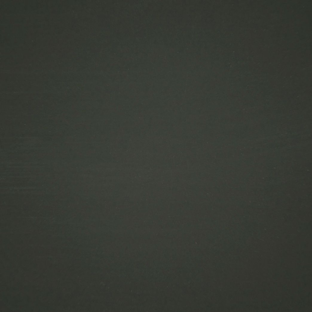 Un gros plan d'un fond noir avec une texture granuleuse.