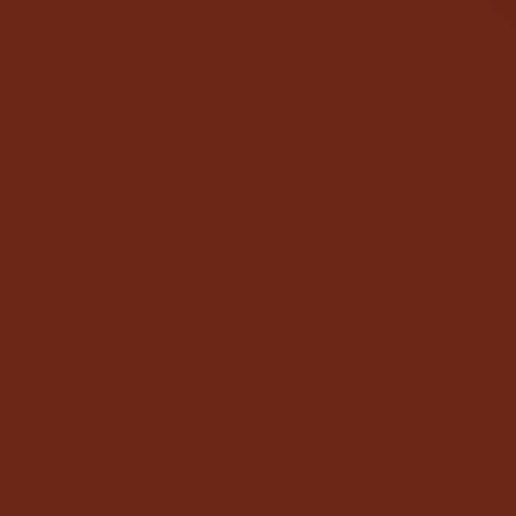 Un gros plan d'un fond rouge avec une texture unie.