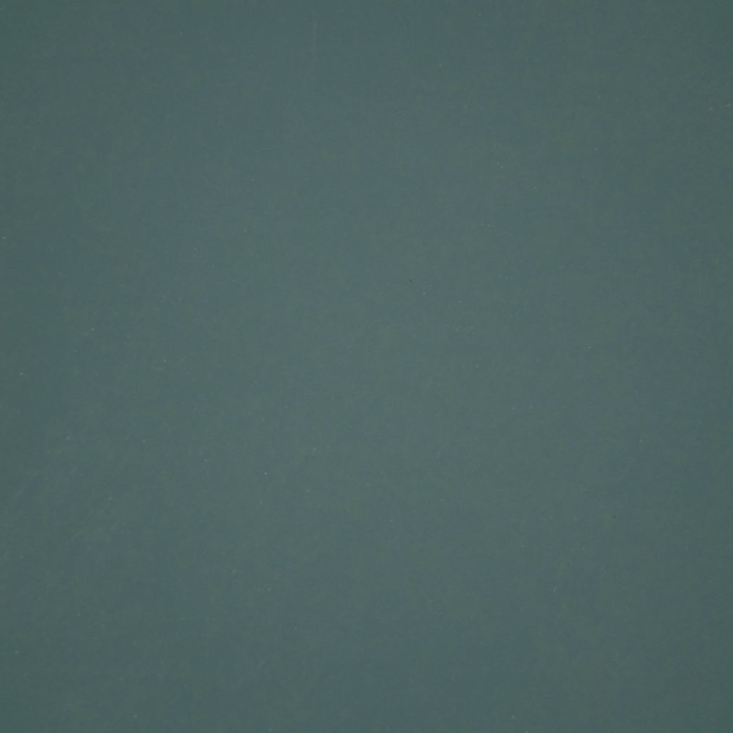 Un gros plan d'un fond gris avec une texture granuleuse.