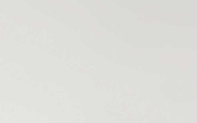 A close up of a white paper texture.