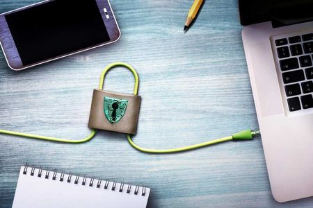 Laptop, Phone, Notepad, and Pencil Arranged Around a Padlock — SSP Insurance In Rockhampton City, QLD Laptop, Phone, Notepad, and Pencil Arranged Around a Padlock — SSP Insurance In Rockhampton City, QLD