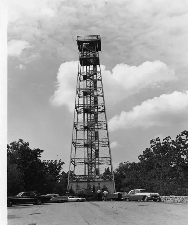 A black and white photo of a tower with stairs