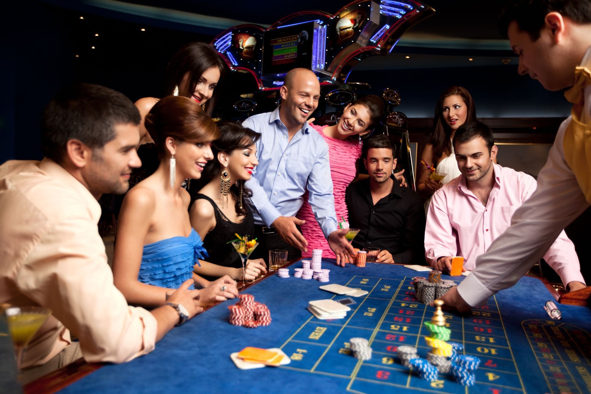 A large room filled with lots of slot machines in a casino.