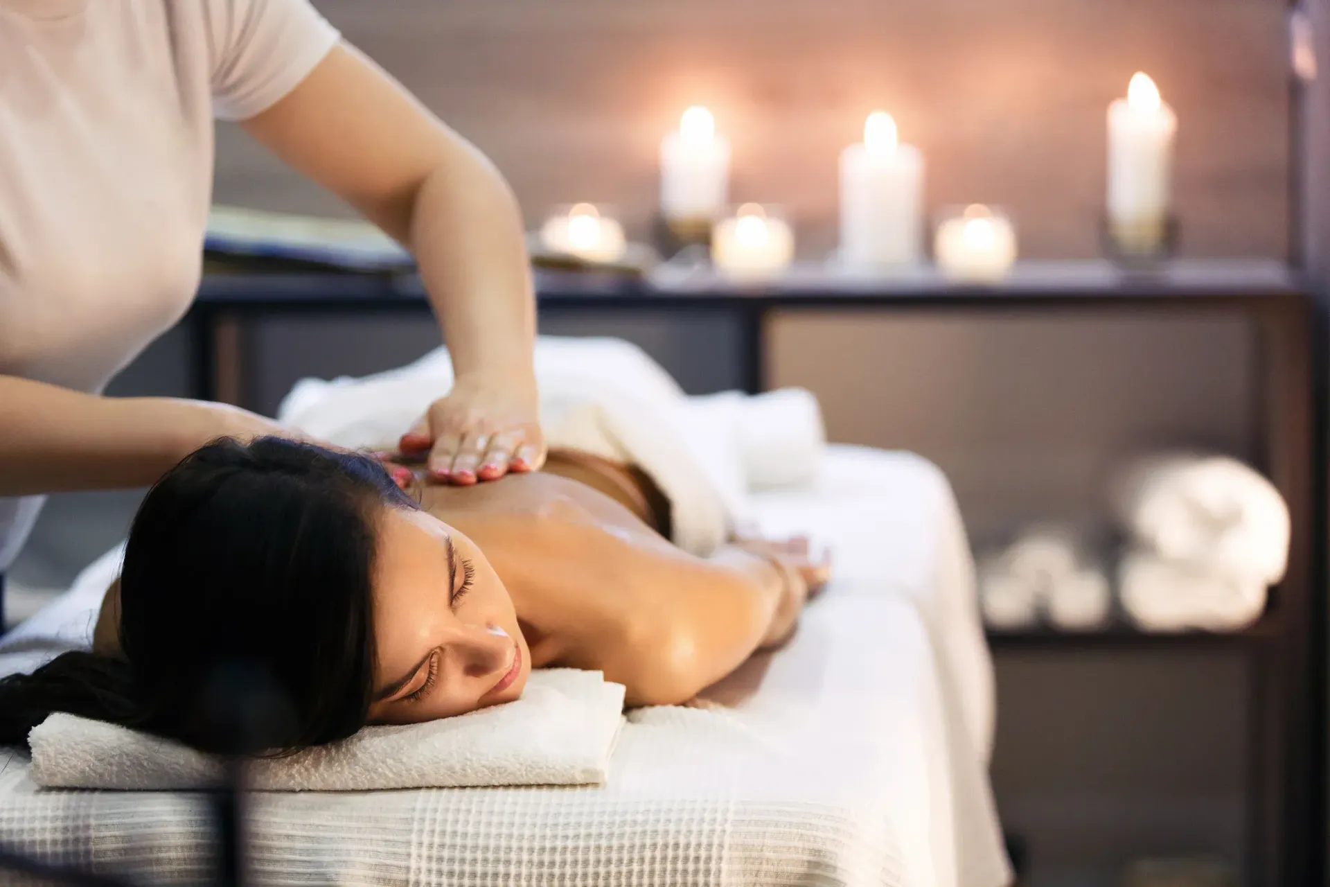 A woman is getting a massage at a spa.