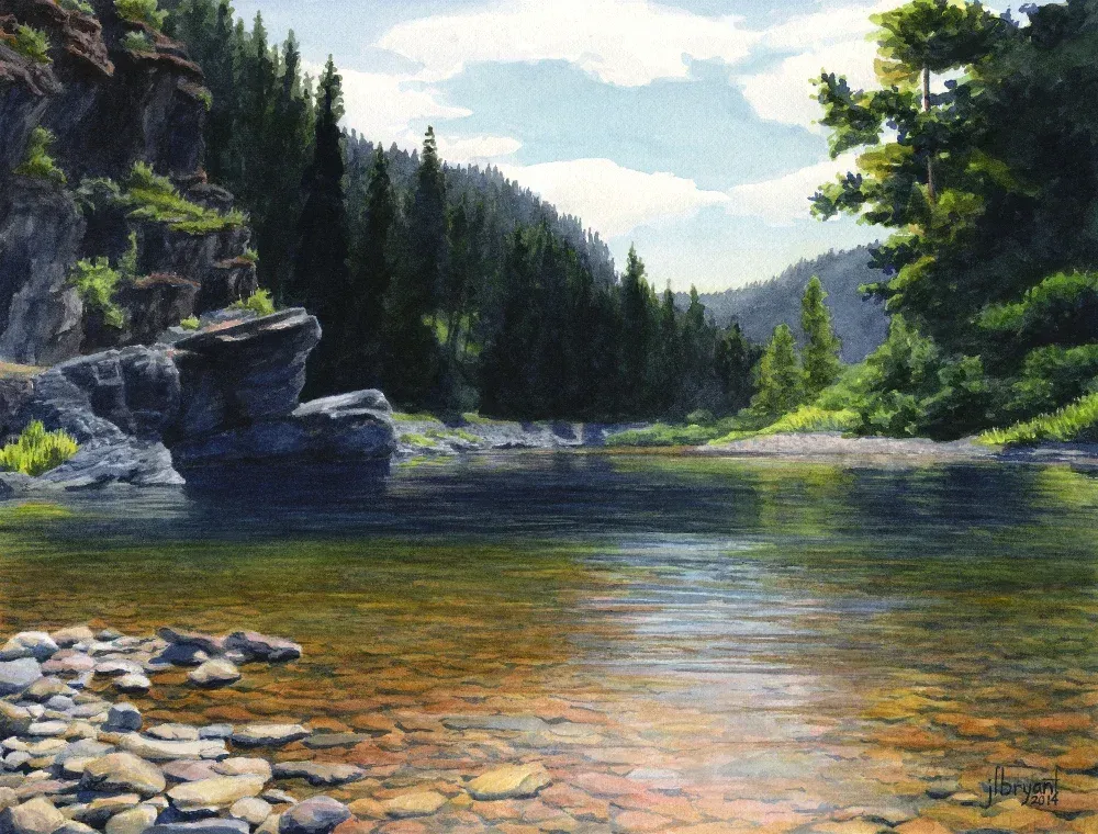 Calm river flows through a valley, surrounded by rocky cliffs and evergreen trees. Sunny, blue sky.