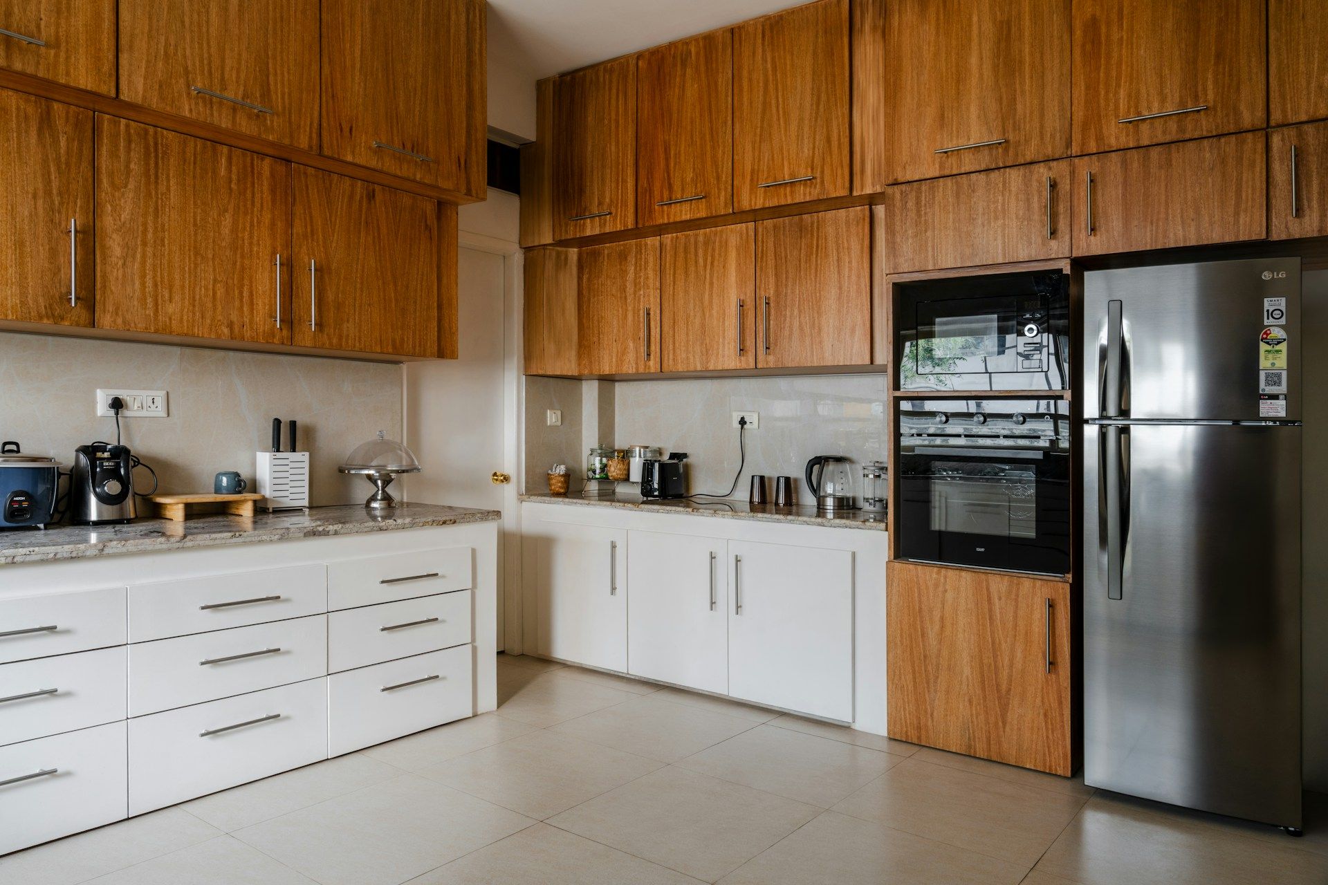 A kitchen with wooden cabinets and stainless steel appliances.
