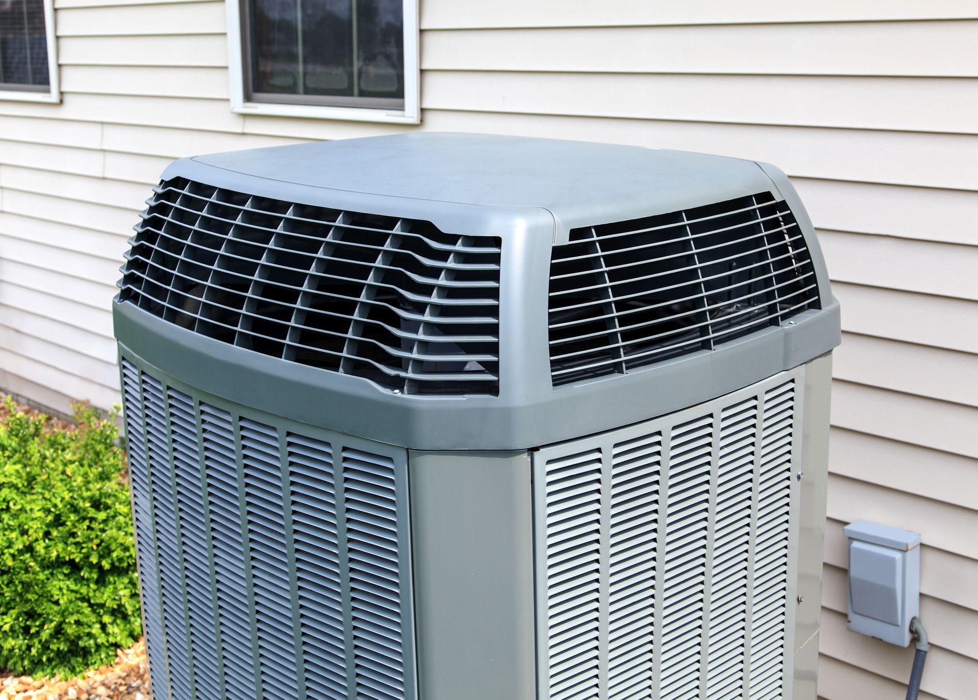 A large air conditioner is sitting outside of a house - Concord, NC - Concord Heating & Air conditioning