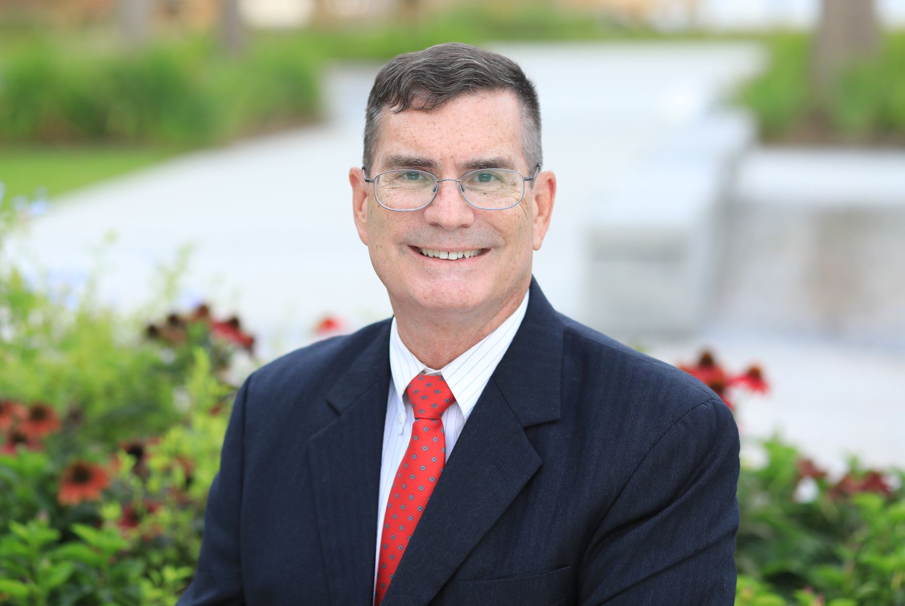 Natural background headshots for real estate professionals, author bios, conference speakers.