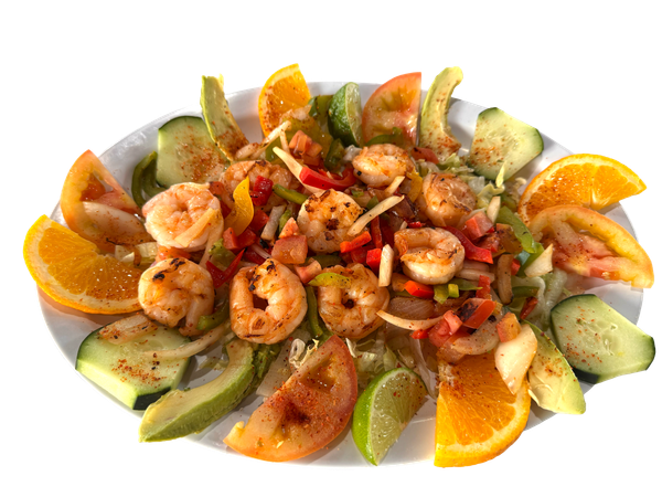 Shrimp salad with orange slices, avocado, and diced vegetables on a white plate