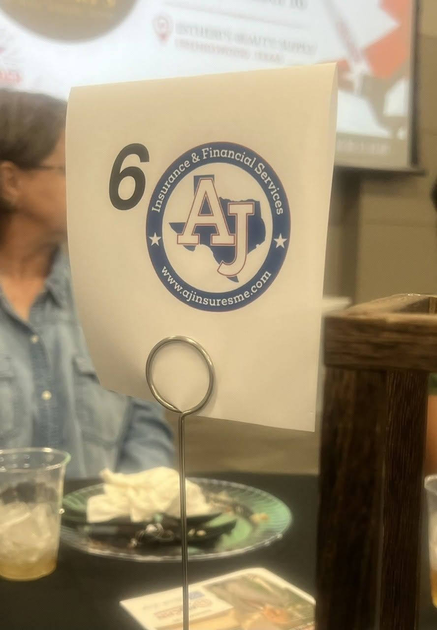 Table number 6 card with blue AJ logo on a restaurant table