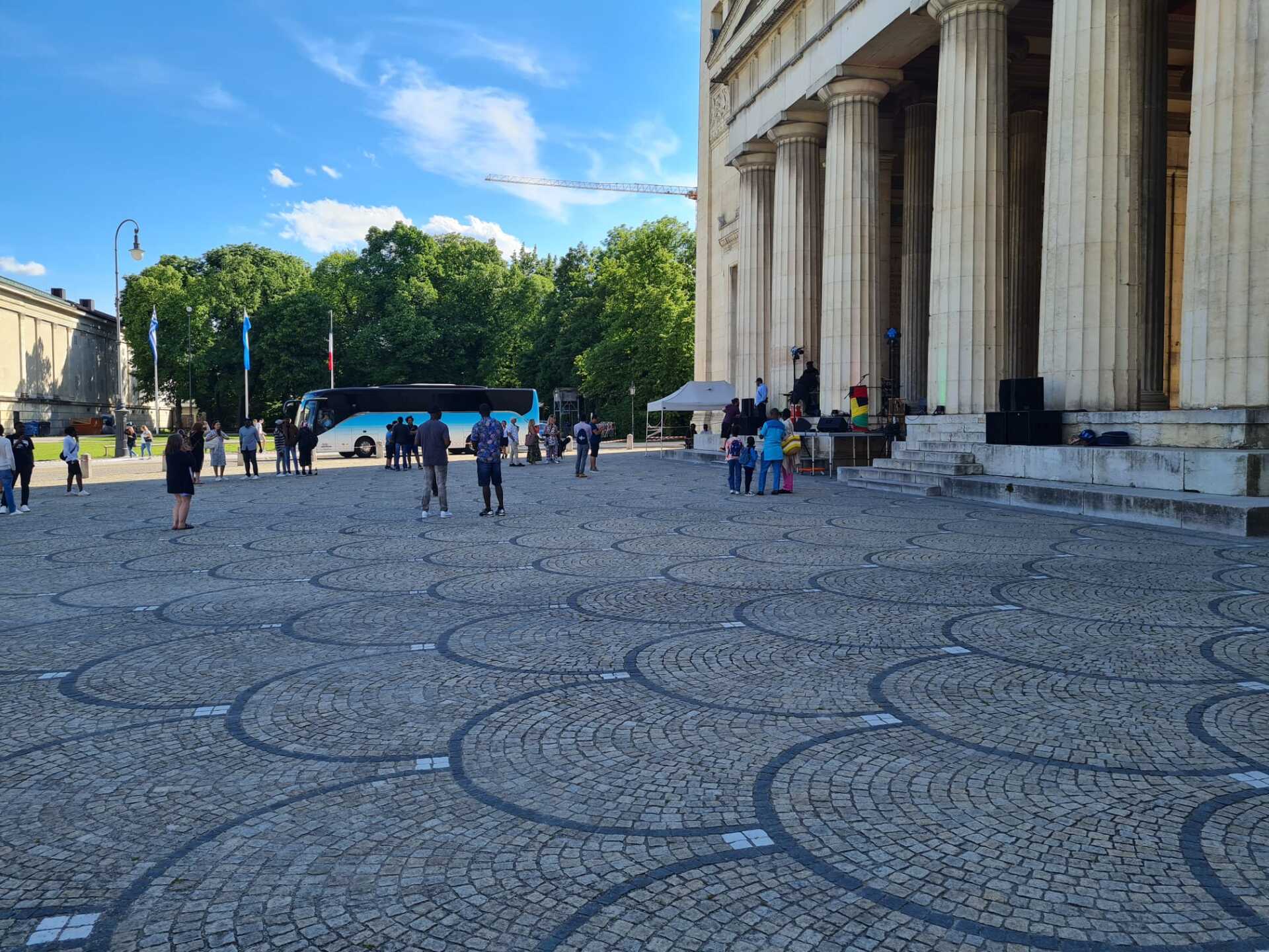 A group of people are standing in front of a building.