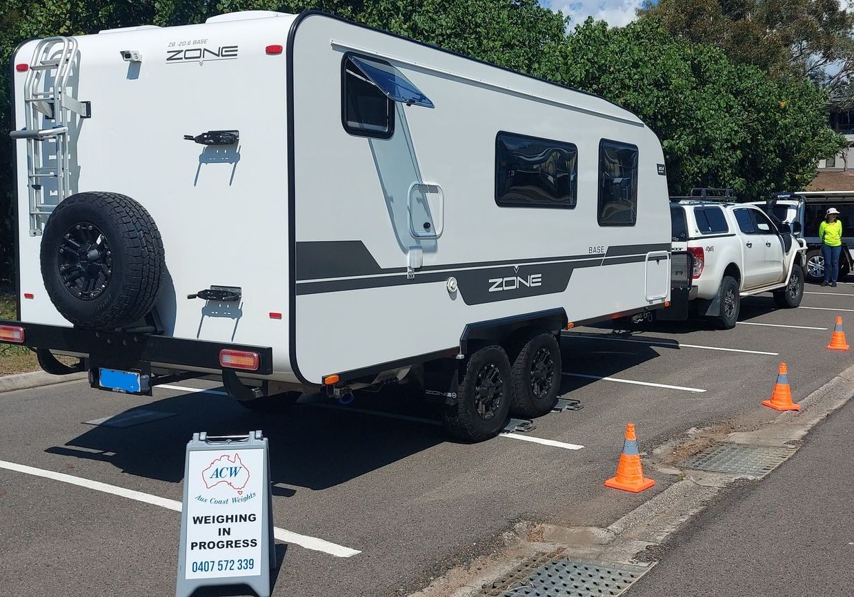 Black And White Caravan - Vehicle Weighing in Gladstone, QLD