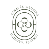Logo: Oval frame, floral design, text 