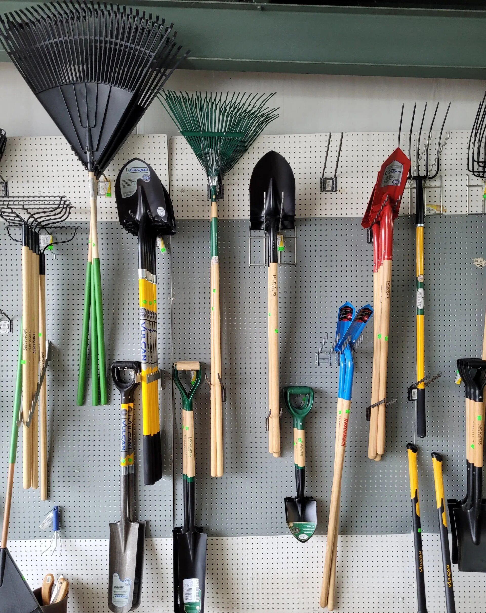 Bunch of Gardening Tools Are Hanging on a Wall — Hattiesburg, MS — McElhaney Plumbing & Hardware Inc