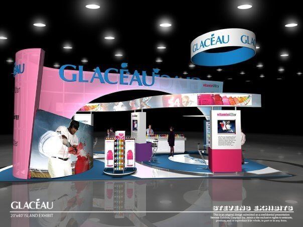 Glaceau booth design with pink and blue branding; event display with workers and products.