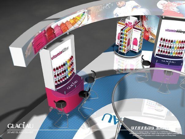 Display of colorful beauty products, possibly makeup, on a circular counter with a curved overhead display.