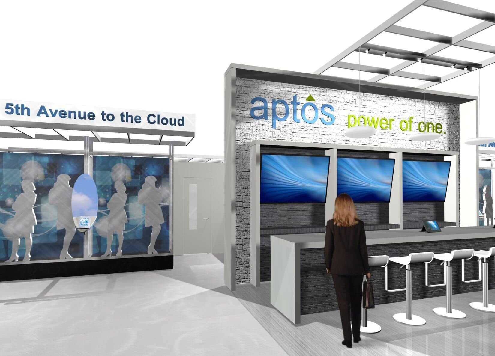 Trade show booth with Aptos branding, displays, and a person walking by.