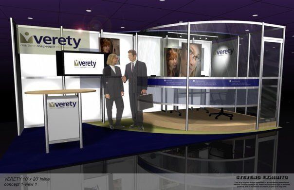 Trade show booth with two people. Booth has 