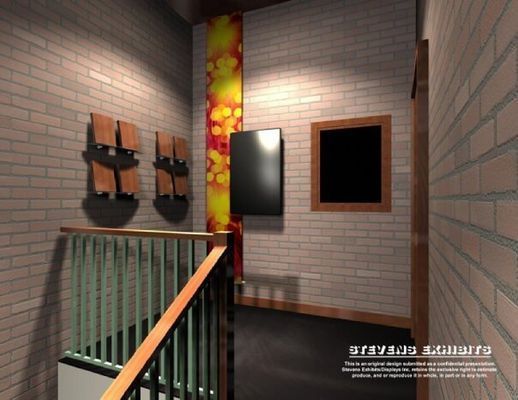 A brick-walled hallway with a staircase, decorative wall panels, and artwork.