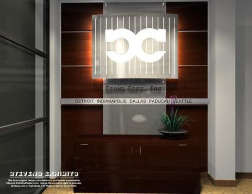 Office reception area with dark wood paneling, illuminated logo, and plant. Locations listed.