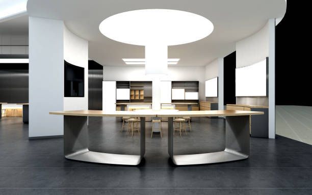 Modern office interior with large central table and curved wall.