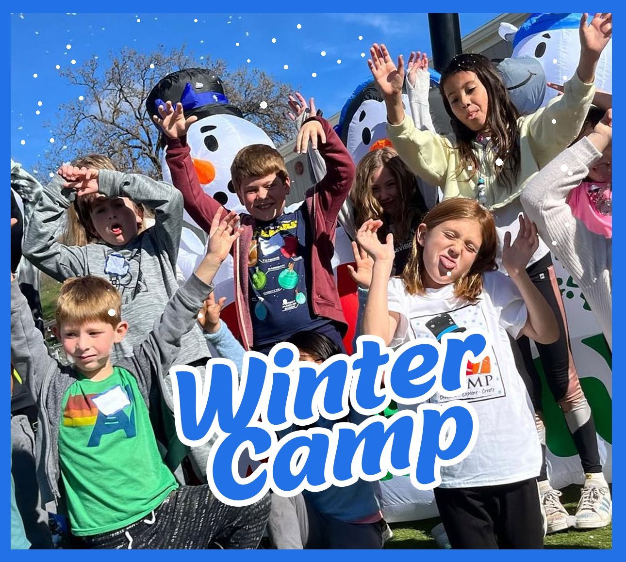 A group of children are posing for a picture in front of a snowman.