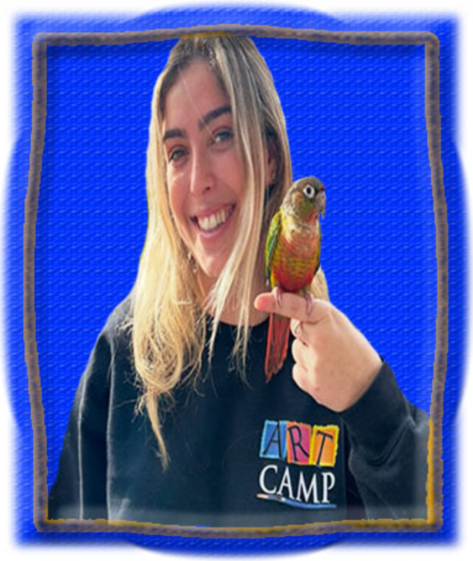 A woman is holding a colorful parrot in her hand.