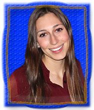 A woman with long hair is smiling in a blue frame.