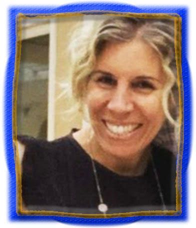 A woman is smiling in a blue frame.