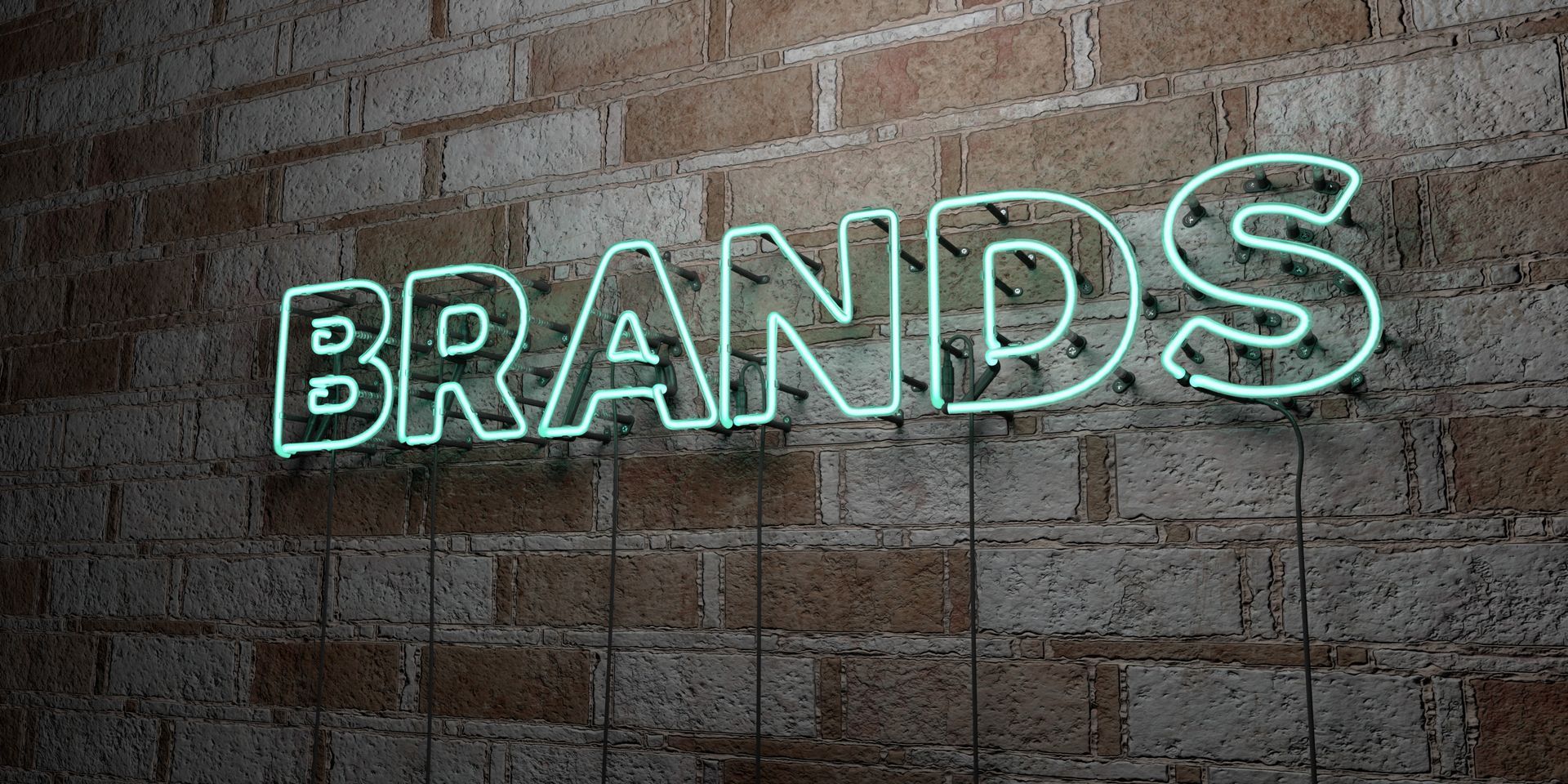 Neon sign on brick wall reads 