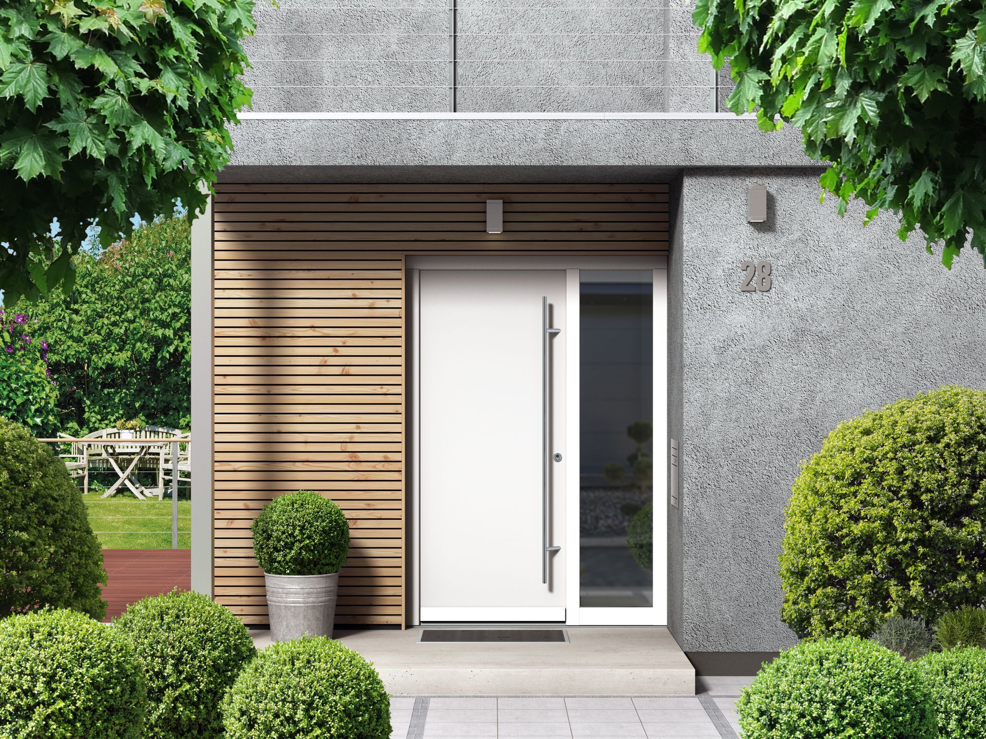 Modern white door with glass panel and long handle, surrounded by landscaping and wood paneling.
