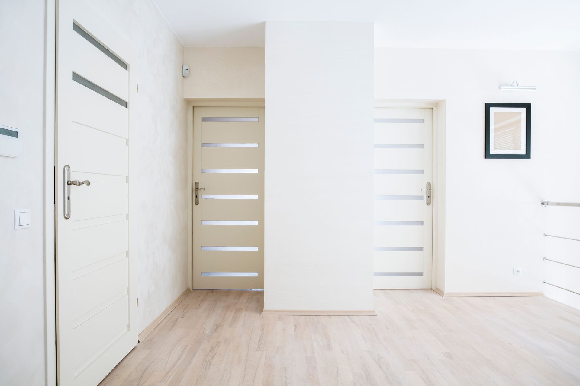 White interior doors in a bright modern hallway