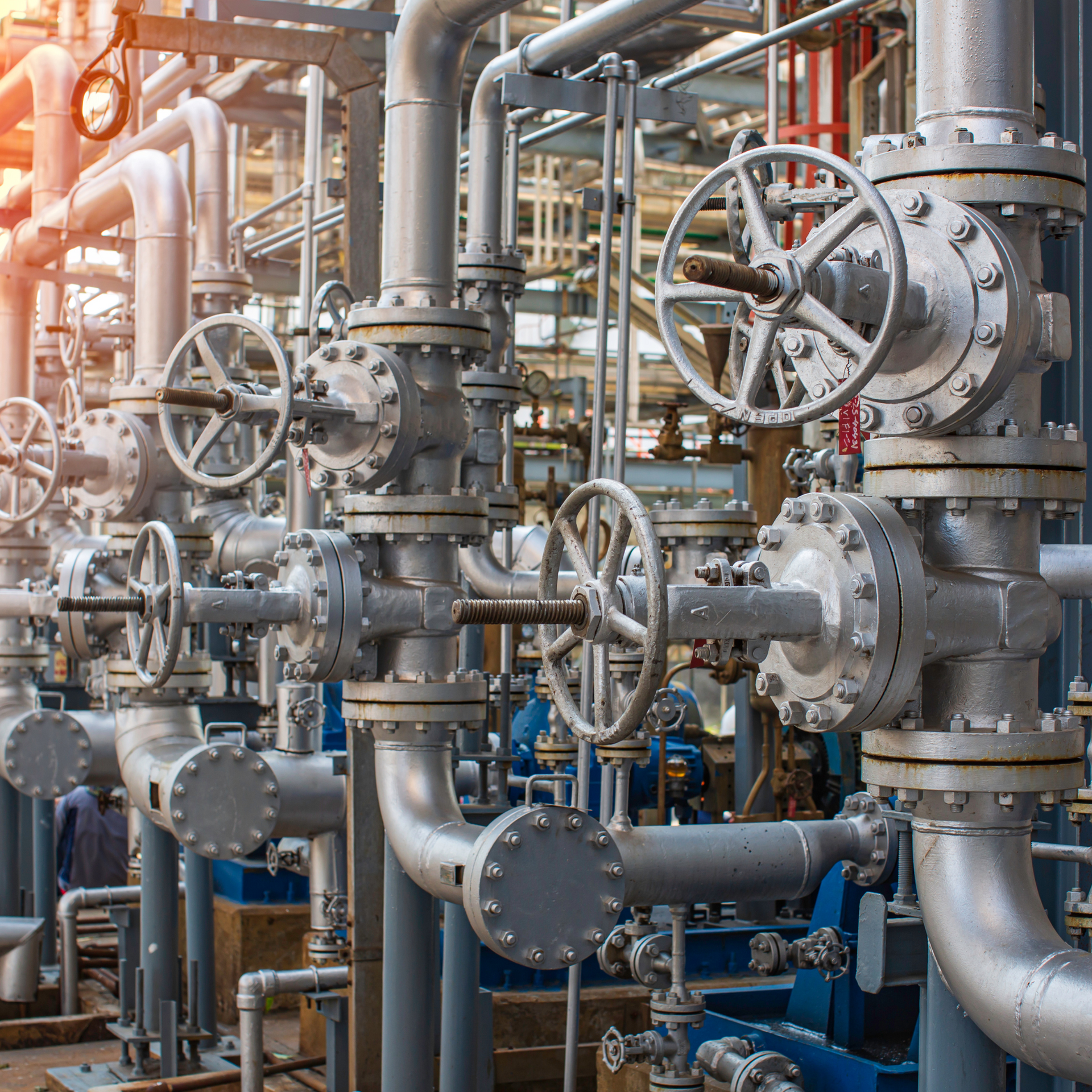 Industrial piping with valves and metalwork.