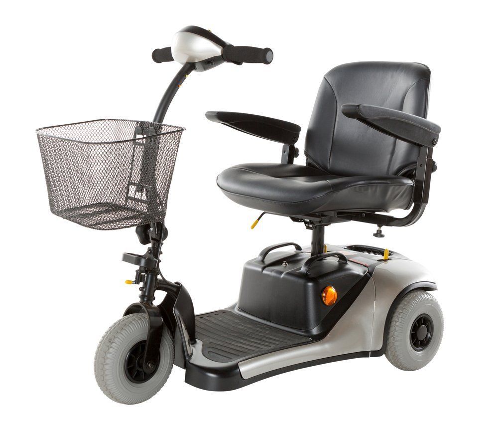 A Mobility Scooter with A Basket Attached to It — Toukley World of Bikes In Toukley, NSW