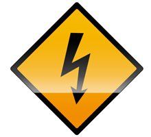 Warning sign: Yellow diamond with black lightning bolt, indicating electrical hazard.