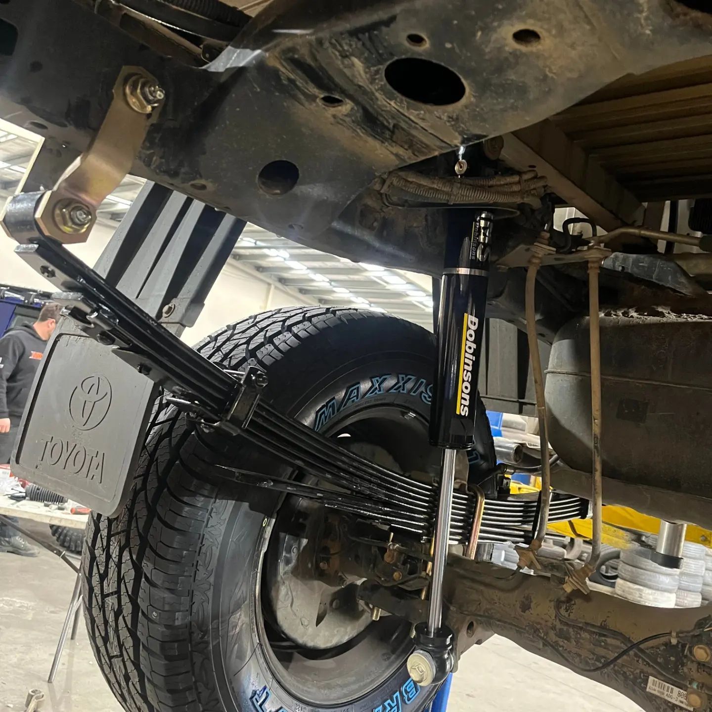 Close-up of a car suspension and wheel assembly with black springs — Bay City A1 Tyres in North Geelong, VIC