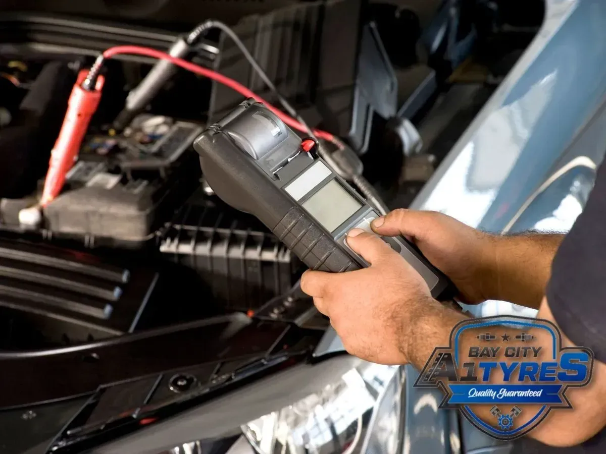 Red and Black Jumper Cables Clipped to A Car Battery in An Engine Bay — Bay City A1 Tyres in North Geelong, VIC