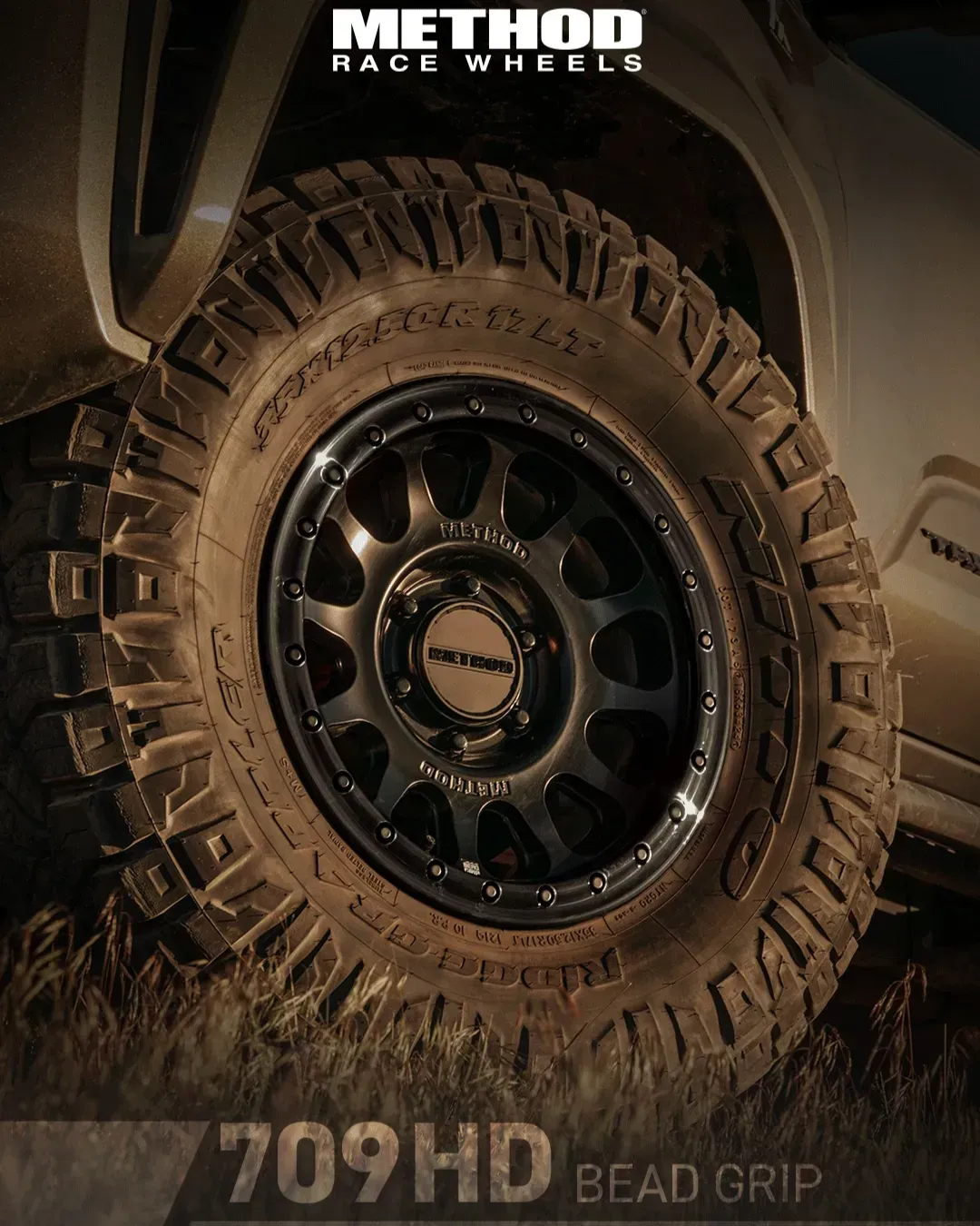Close-Up of Large Yellow Construction Vehicle Wheels on Grass — Bay City A1 Tyres in North Geelong, VIC