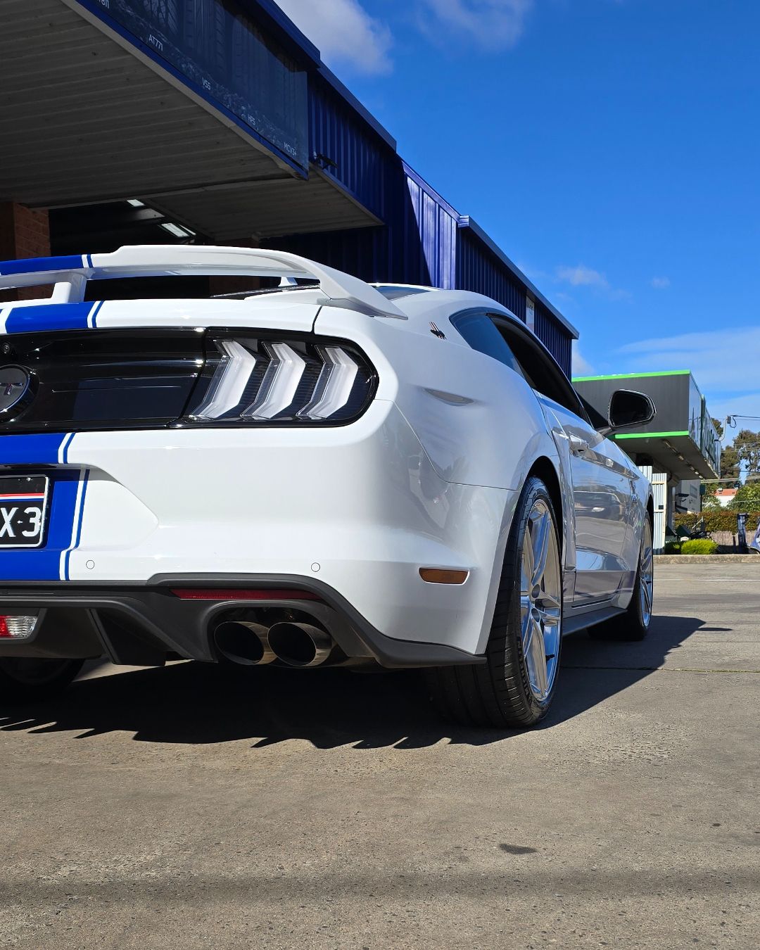 Two Black Exhaust Pipes Beneath a Car Bumper, Viewed from The Rear — Bay City A1 Tyres in North Geelong, VIC