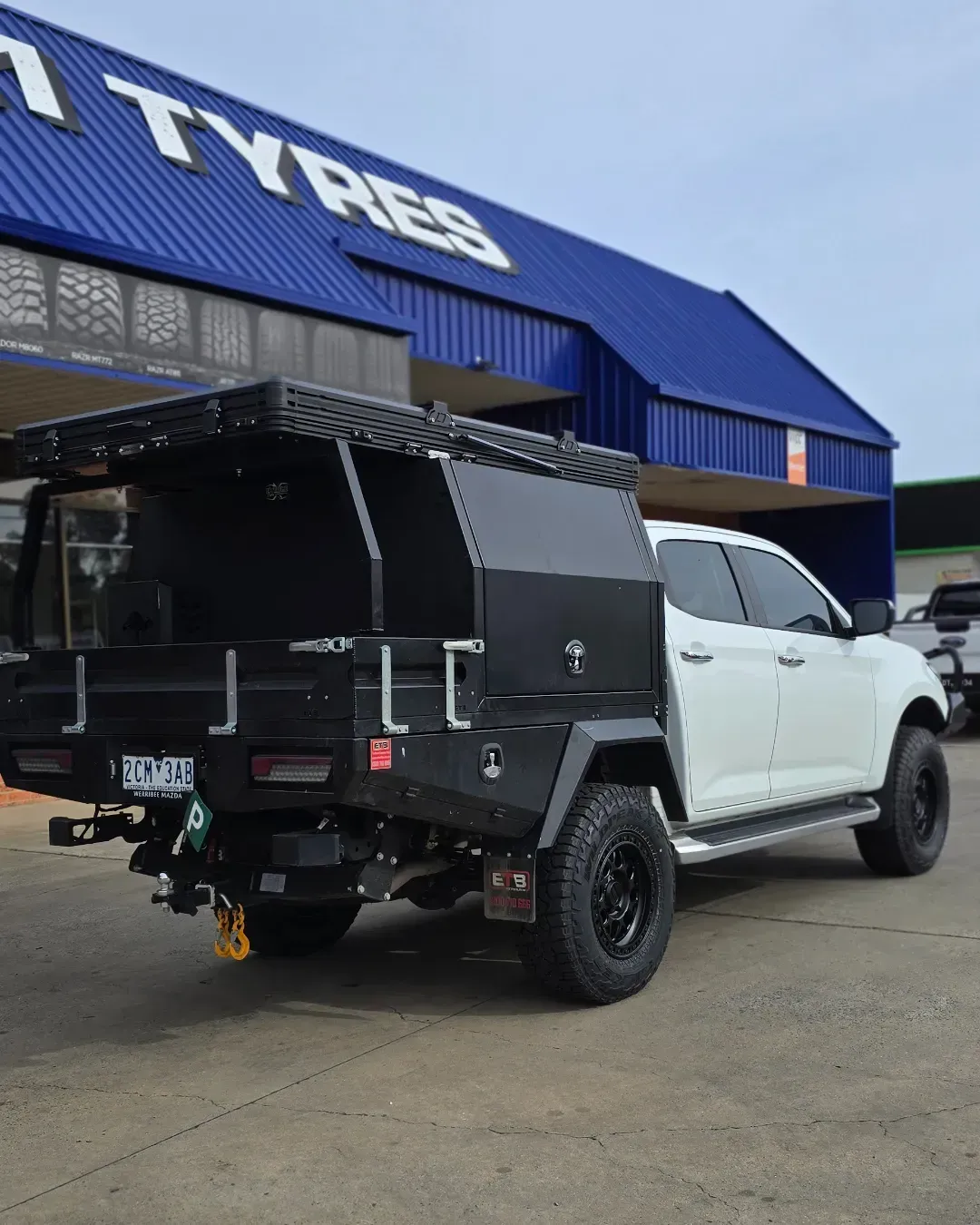 White and Black Utility Pickup with Flatbed Parked Outside — Bay City A1 Tyres in North Geelong, VIC