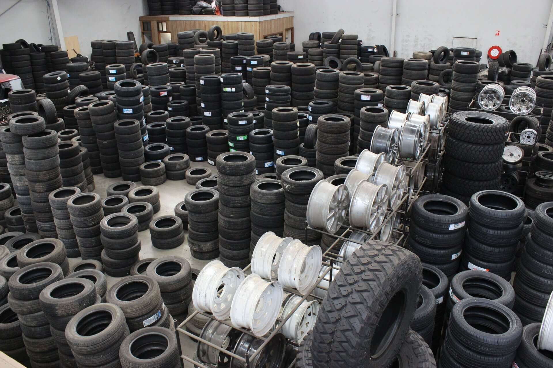 Stacks of Car Tires and Rims Piled in A Warehouse or Tire Shop Yard — Bay City A1 Tyres in North Geelong, VIC