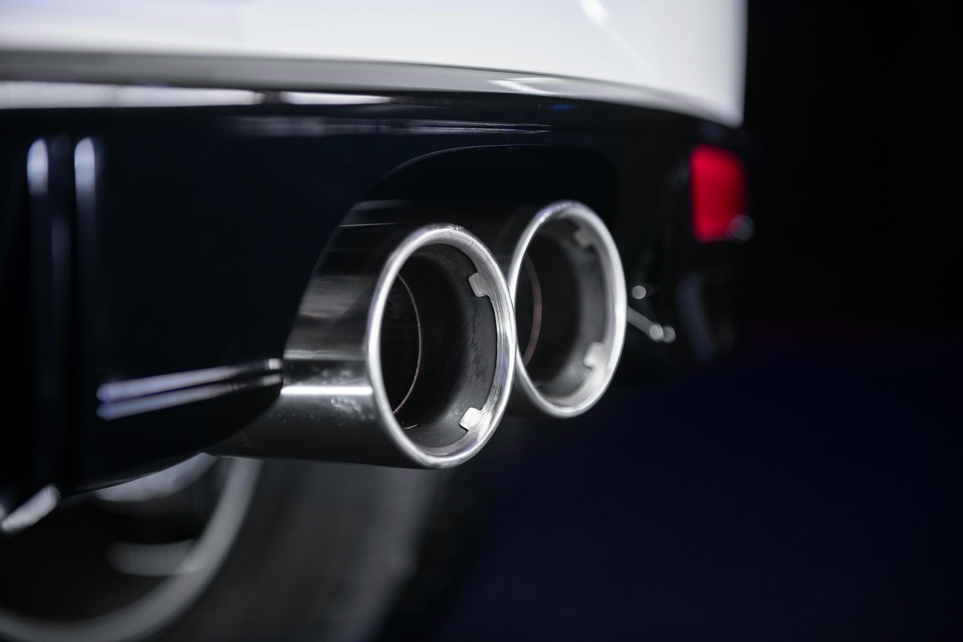 Chrome Dual Exhaust Tips on A Black Car Rear Bumper — Bay City A1 Tyres in North Geelong, VIC