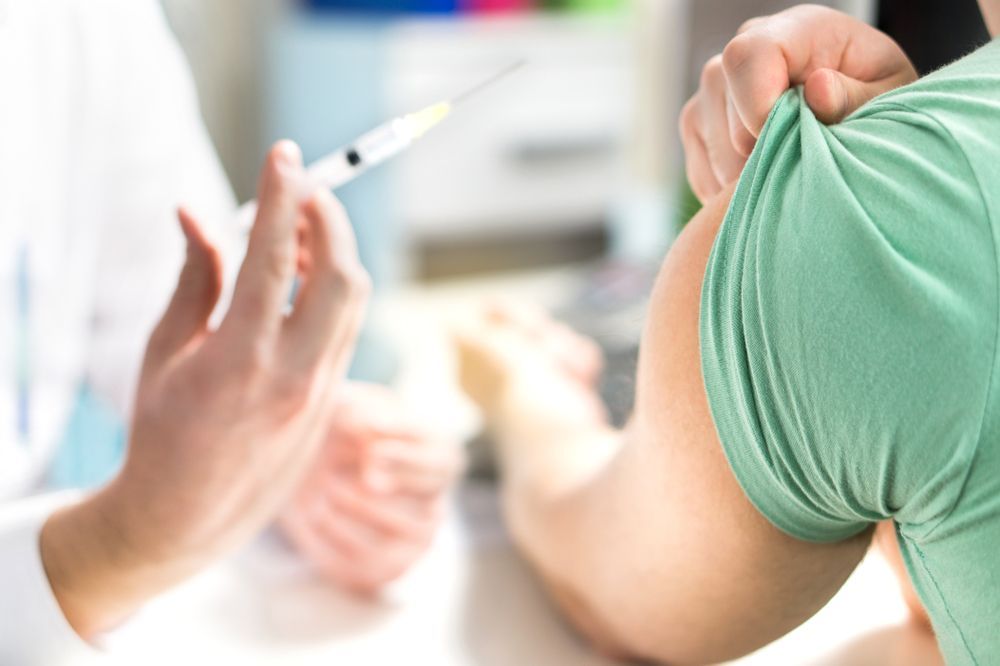 A Person Receiving a Vaccine Injection — Deception Bay Doctors In Deception Bay, QLD